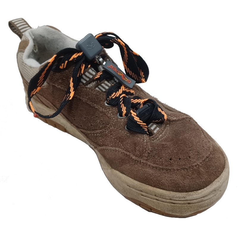 Brown suede trainers with black and orange laces fixed with a toggle.