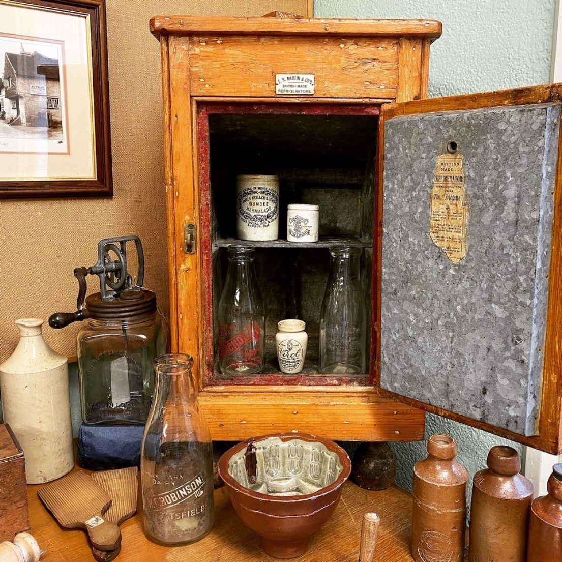 A small wooden cabinet, which was an early form of 'refrigerator'.